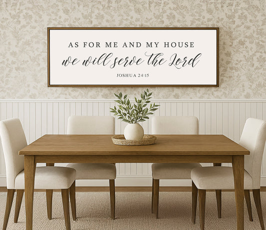 a dining room table with chairs and a framed sign above it