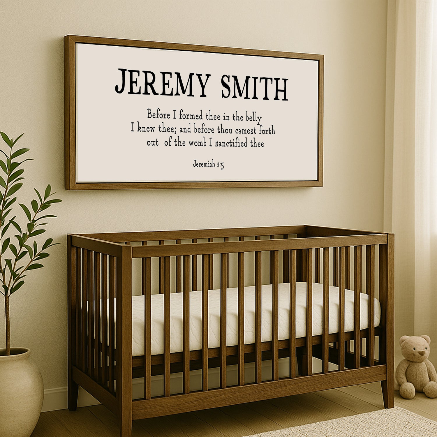 a baby crib with a teddy bear next to it