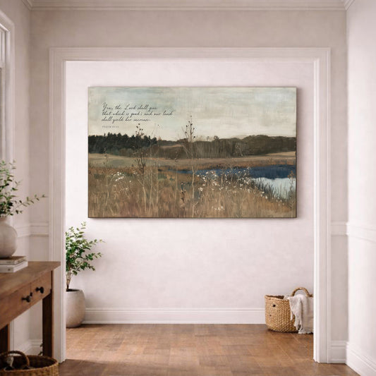 a large landscape painting hanging on a white wall in a room with a wooden floor.