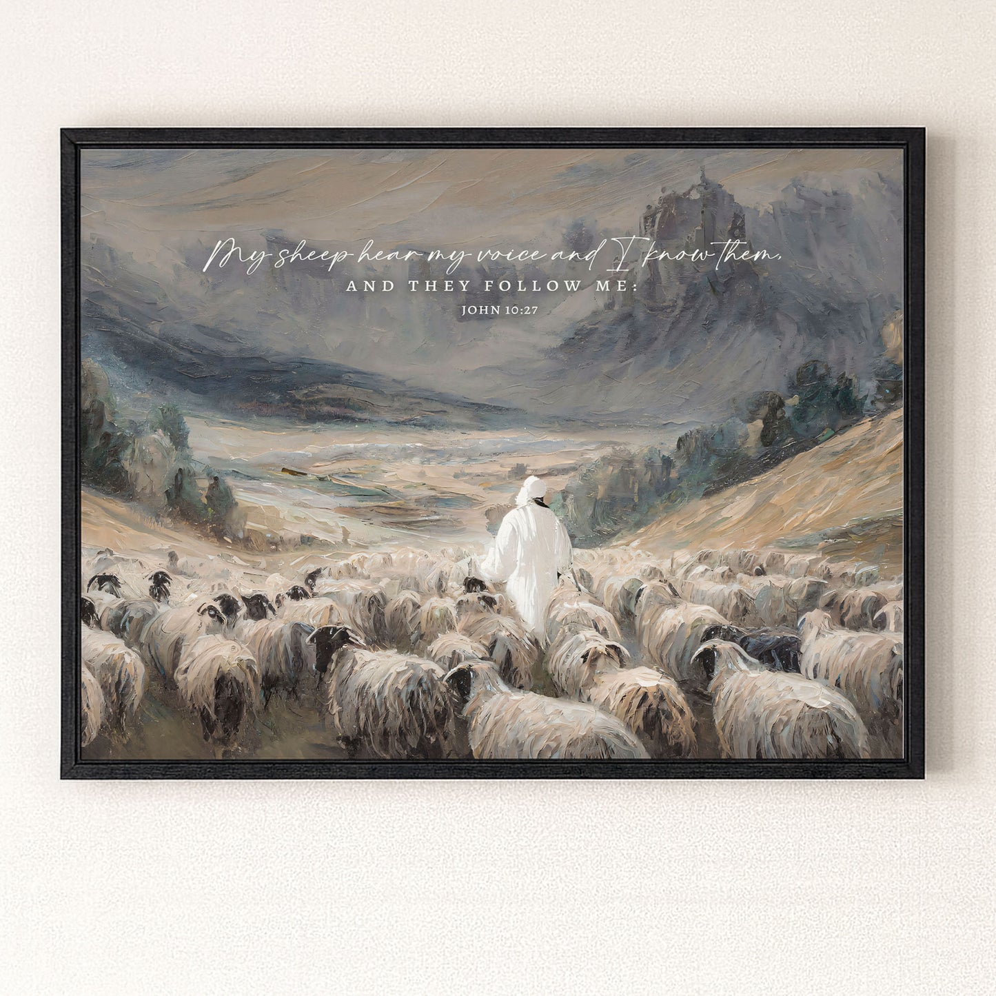 a shepherd tending to his flock of sheep in a mountainous landscape.