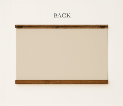 a blank white canvas or board mounted on a wall, with the word 