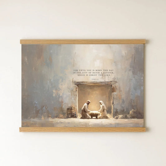 The image is a painting depicting the Nativity scene, with the figures of Mary, Joseph, and baby Jesus in a manger. The painting is framed and hung on a wall.