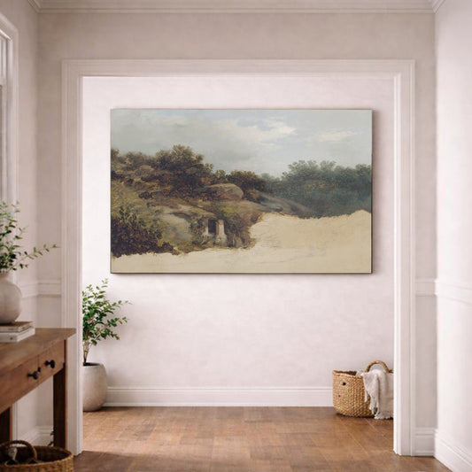 a large landscape painting hanging on a white wall in a room with a wooden floor.