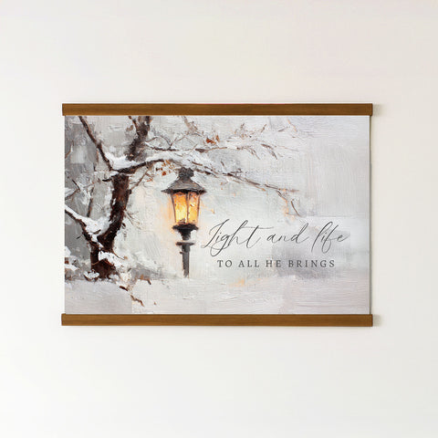 The image is a painting of a street lamp with a snowy tree in the background, and the text 