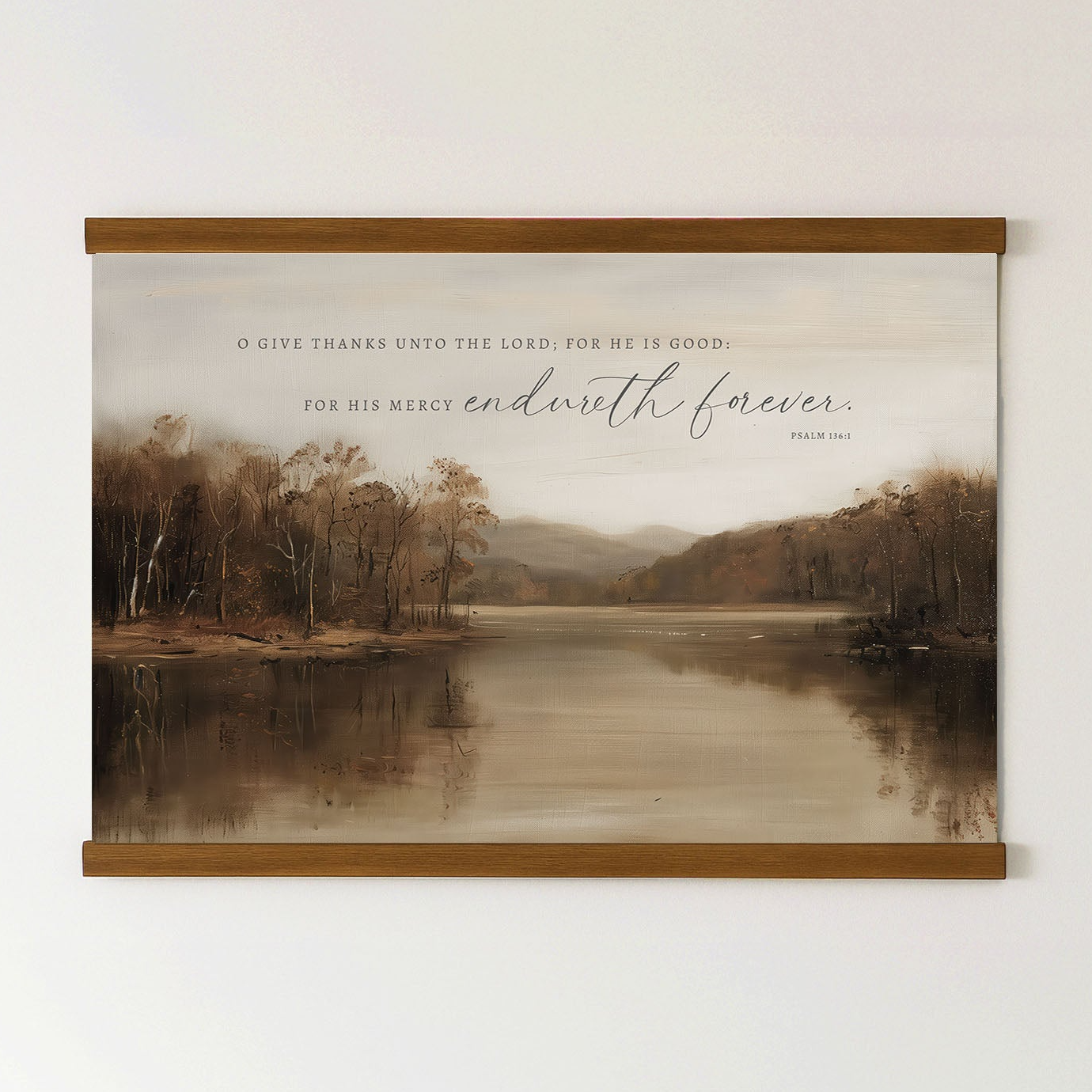 The image is a framed print of a serene landscape featuring a lake surrounded by trees and mountains. The text on the print reads, "O give thanks unto the Lord, for he is good; for his Mercy endures forever."