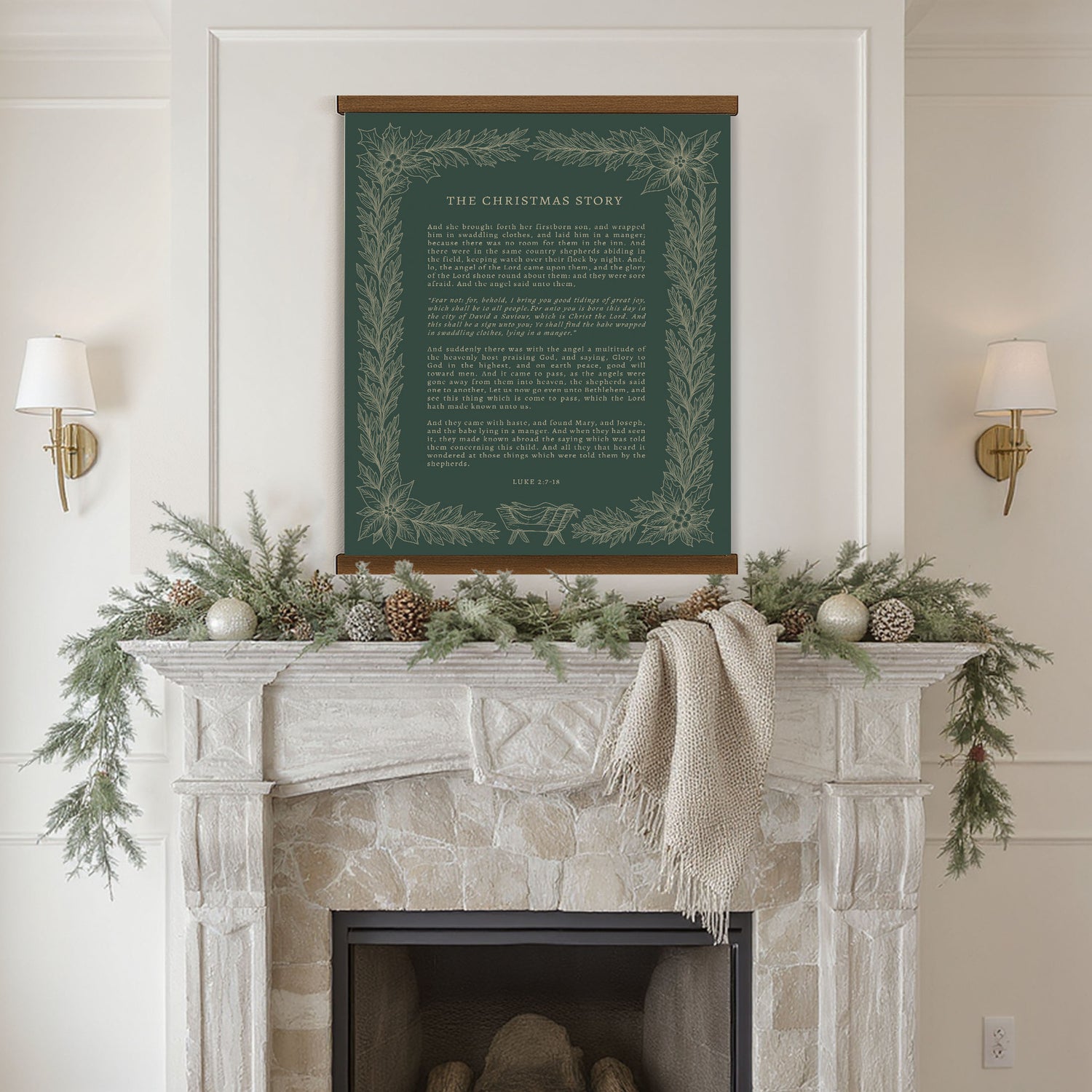 a fireplace mantel decorated with greenery, pine cones, and ornaments, with a framed inspirational quote displayed above it.