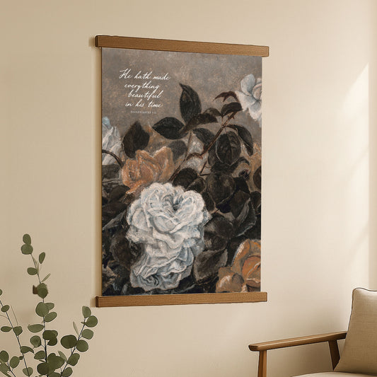 The image is a framed painting hanging on a wall, depicting a floral arrangement with various colored flowers.