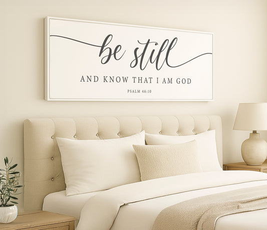 a bed with a white comforter and pillows